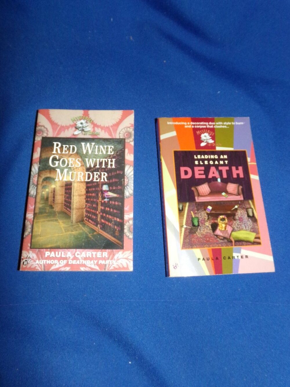 Set of 2 Paula Carter Cozy Mystery Paperback Books - Mysteries By Design Series